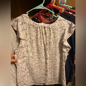 White blouse with pink/black design